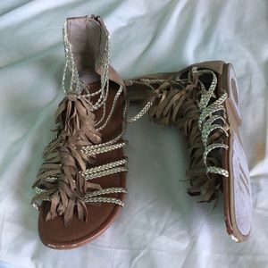 Brown and gold gladiator sandals.